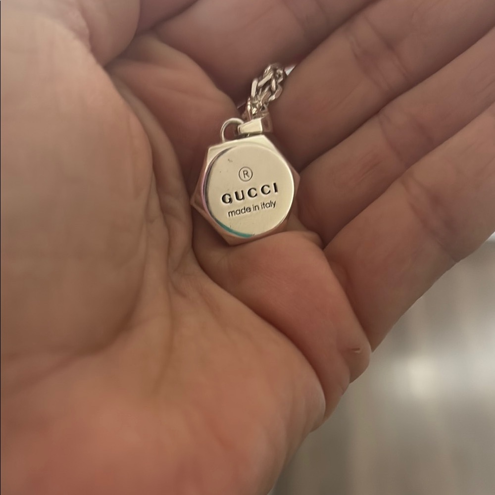 Authentic Gucci Silver Trademark Necklace with receipt box and bag.
